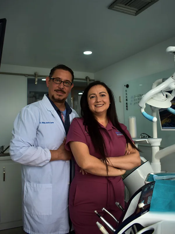 Two dental practice owners standing in their clinic